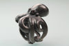 Octopus Ring in blackened sterling silver with red ruby eyes