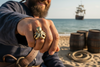 Bronze octopus ring on a pirate smiling 